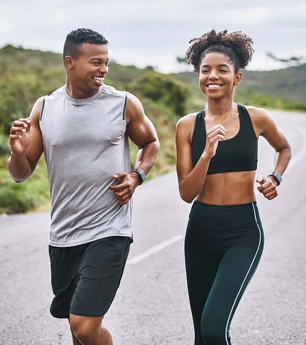 Couple Running on Road